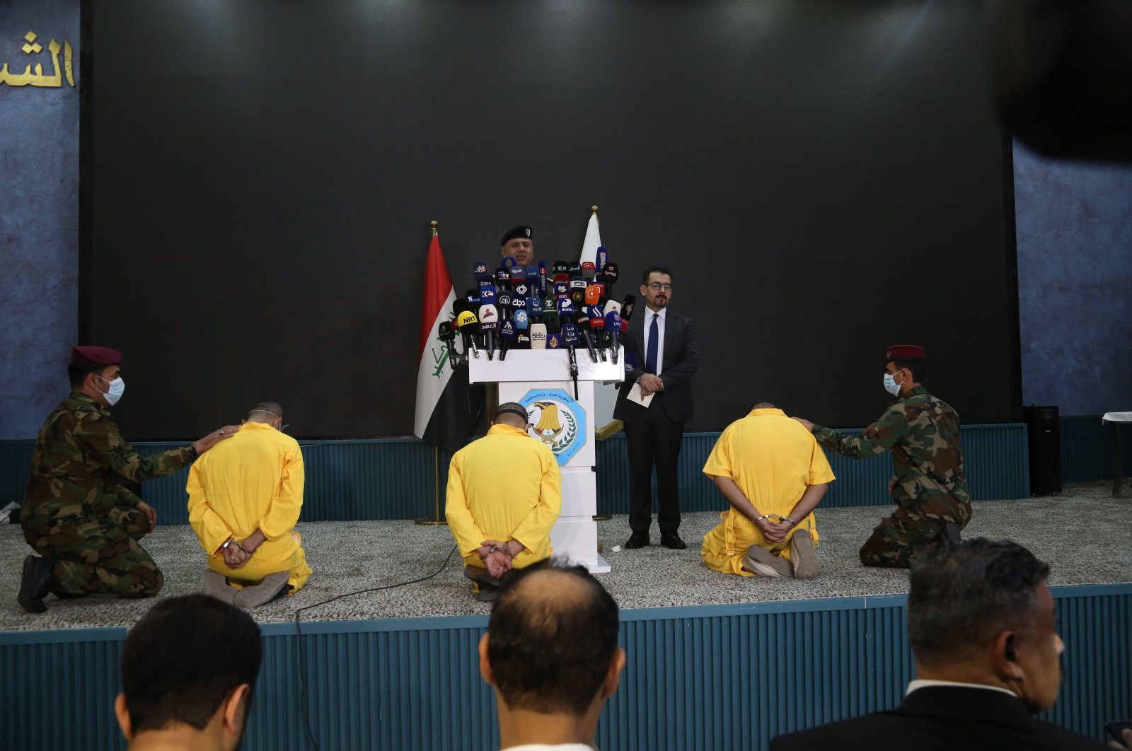 Iraq's Interior Ministry spokesperson Miqdad Miri al-Moussawi speaks at a news conference in front of captured PKK terrorists, Baghdad, Iraq, July 1, 2024. (AA Photo)
