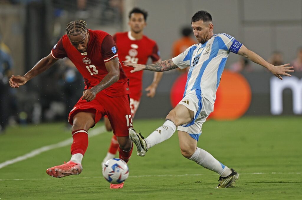 Argentina's Lionel Messi (R) in action with Canada's Derek Cornelius during the CONMEBOL Copa America 2024 semi-finals match between Argentina and Canada, East Rutherford, New Jersey, U.S., July 9, 2024. (EPA Photo)