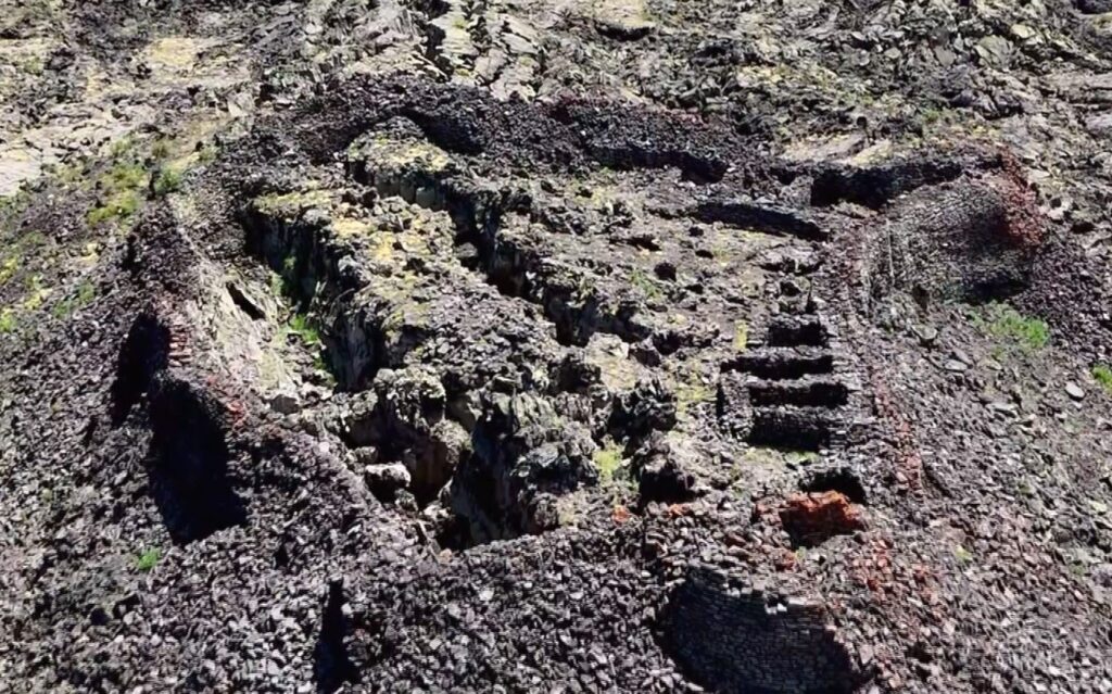 An aerial view of the ancient castle has been captured by a drone nestled among extinct lava streams near Çaldıran, Van, Türkiye, July 10, 2024. (IHA Photo)