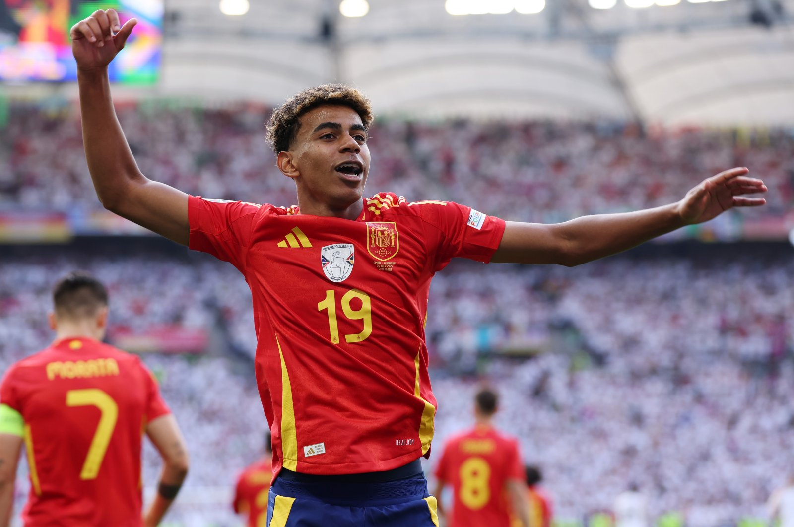 Spain's Lamine Yamal celebrates after teammate Dani Olmo scores his team's first goal during the UEFA EURO 2024 quarterfinal match between Spain and Germany at Stuttgart Arena, Stuttgart, Germany, July 5, 2024. (Getty Images Photo)