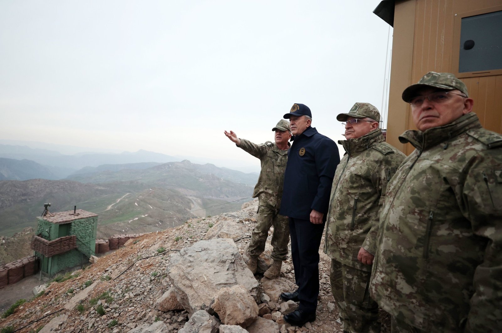 Then-Defense Minister Hulusi Akar (C) and then-Chief of Staff Yaşar Güler (R-2) watch as the Turkish military units near the border with Iraq carry out Operation Claw-Lock, April 24, 2022. (DHA Photo)