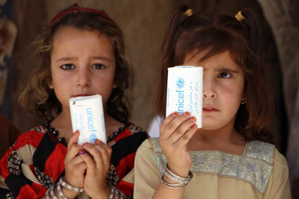 Afghan children show soap bars distributed by UNICEF during a polio vaccination drive in Kandahar, Afghanistan, July 8, 2024. (EPA Photo)
