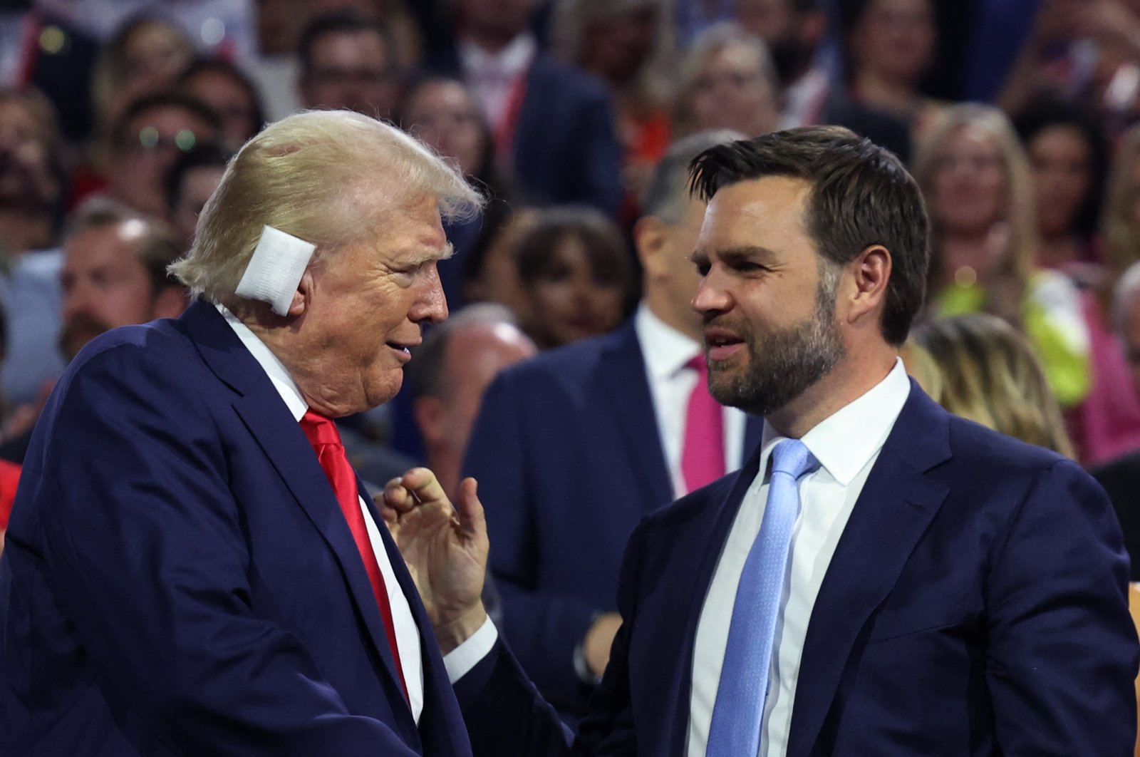 Republican nominees Donald Trump and J.D. Vance interact on Day 1 of the RNC at the Fiserv Forum in Forum in Milwaukee, Wisconsin, U.S., July 15, 2024. (Reuters Photo)
