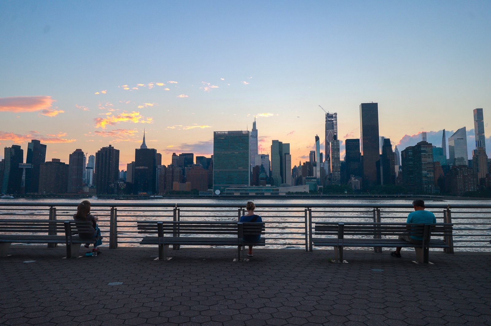 People are seen in Long Island with the Manhattan skyline in the background in New York City, New York, U.S., July 7, 2024. (AA Photo)