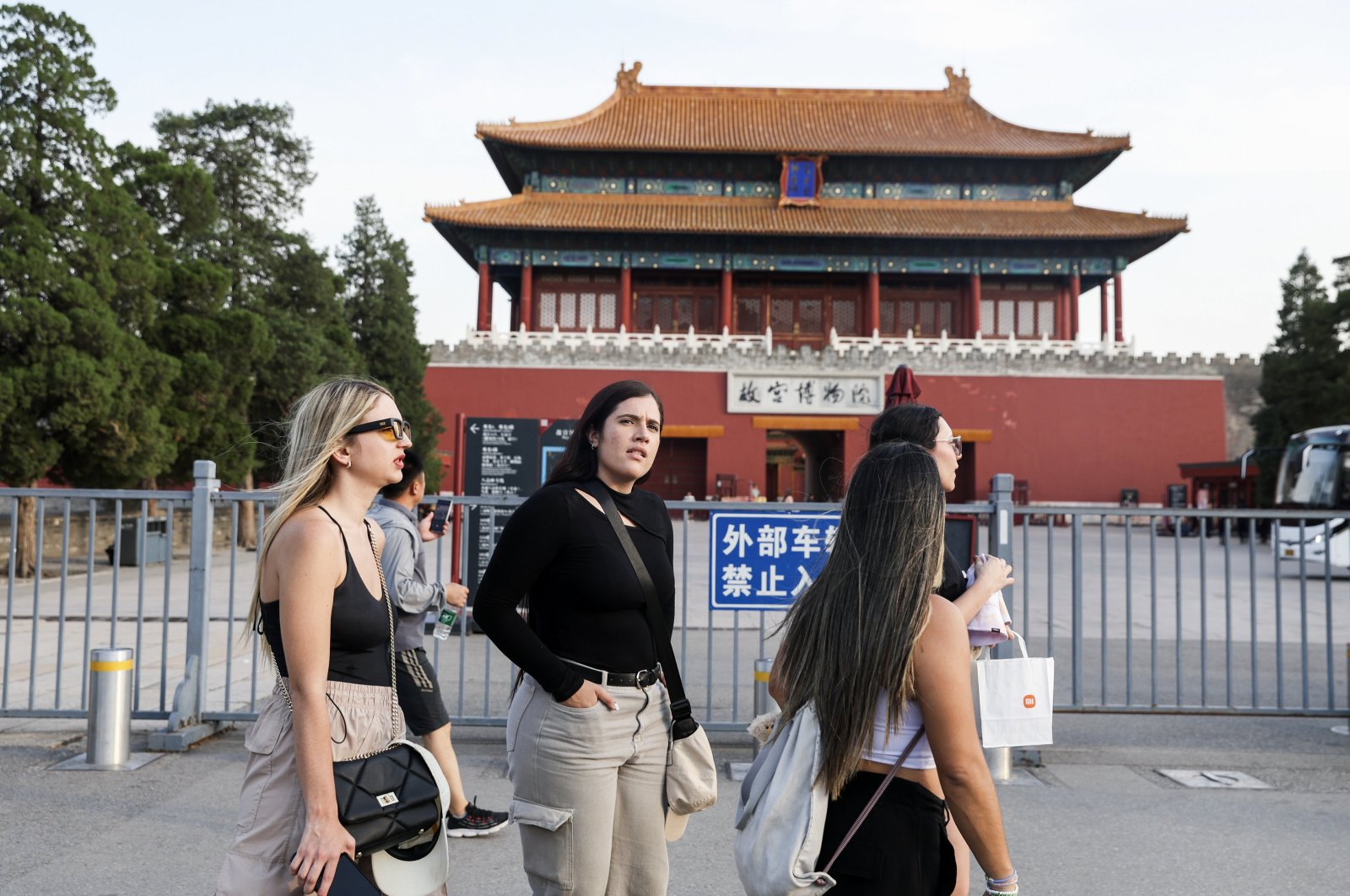 Foreign tourists walk near the Forbidden City in Beijing, China, June 26, 2024. (EPA Photo)
