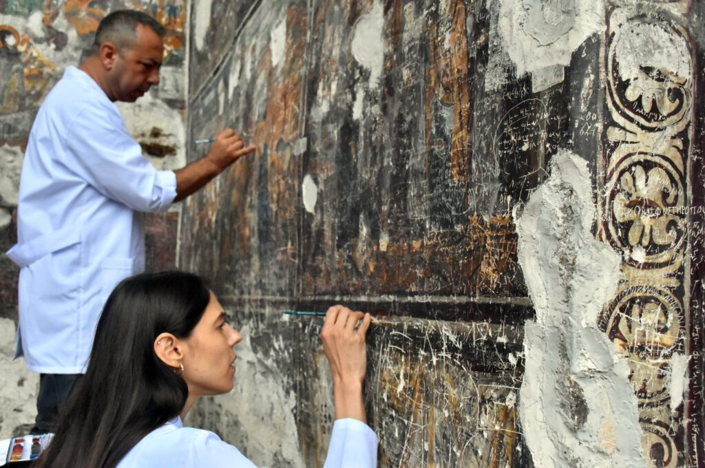 The damage caused by previous visitors to the frescoes is being repaired using undertone (authentic coloring) and "acqua sporca" (dirty water) techniques, Trabzon, Türkiye, July 14, 2024. (AA Photo)