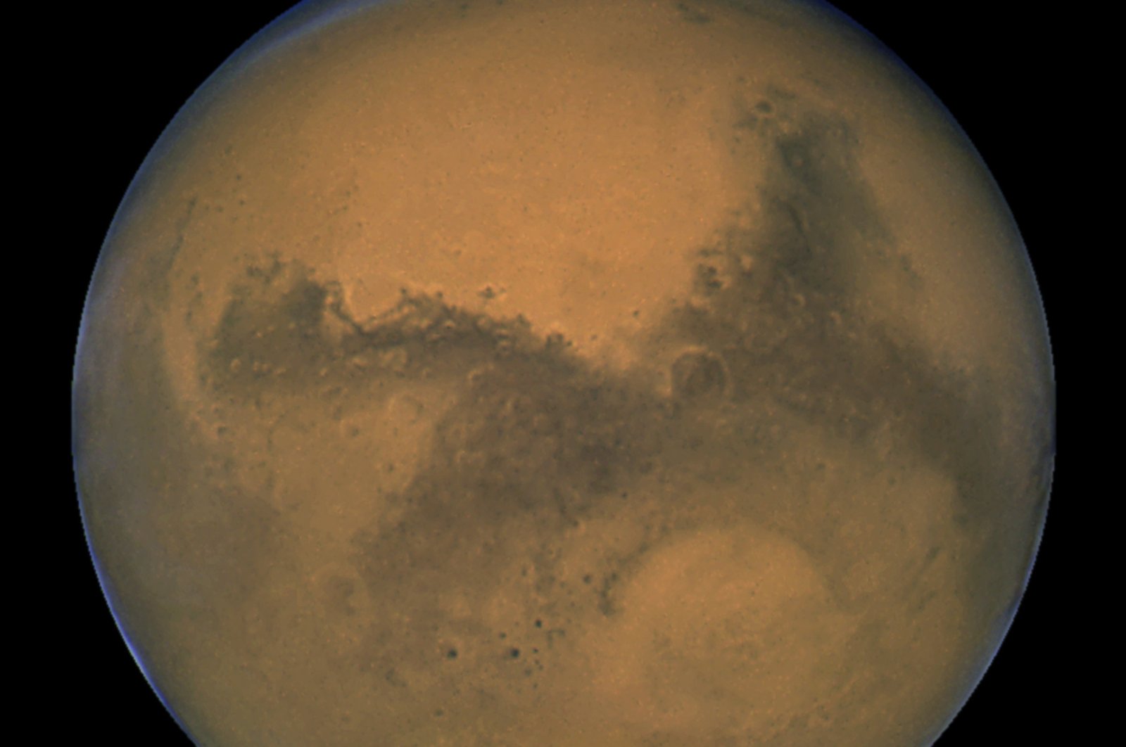 This image made available by NASA shows Mars as it lines up with the sun and the Earth,  Aug. 26, 2003. (AP Photo)