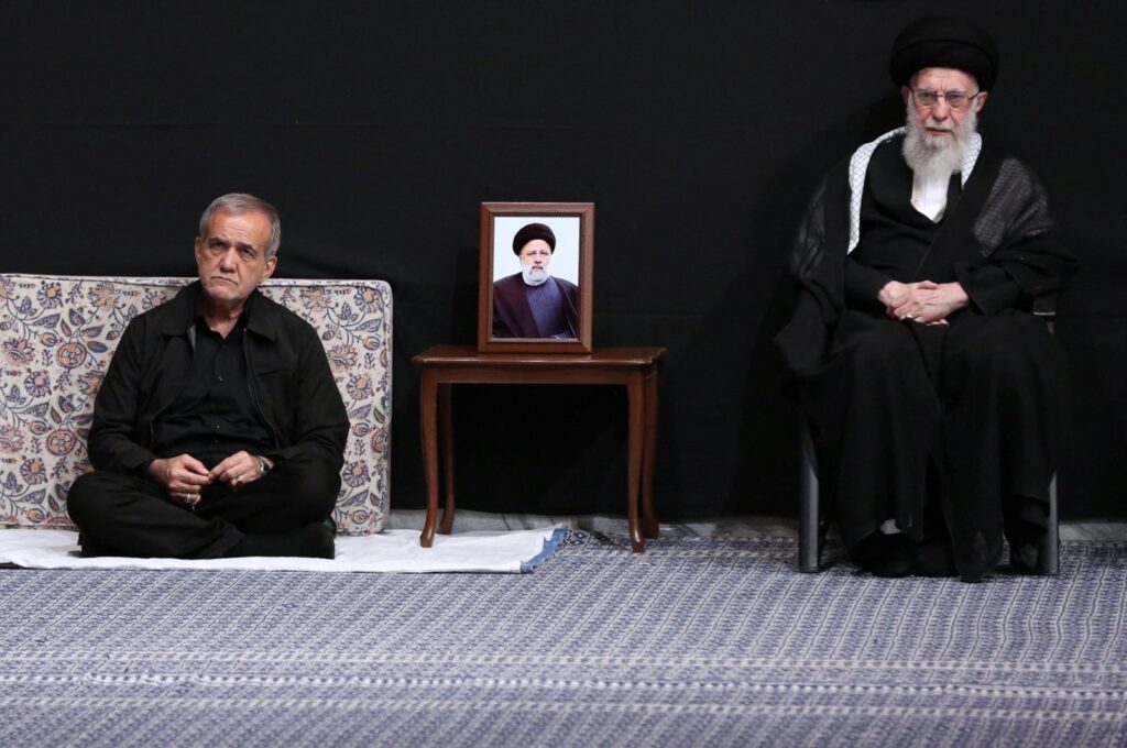 A handout picture provided by the office of Iran's Supreme Leader Ayatollah Ali Khamenei shows him (R) and Iran's newly-elected President Masoud Pezeshkian attending a mourning ritual, in Tehran, Iran, July 12, 2024. (AFP Photo)