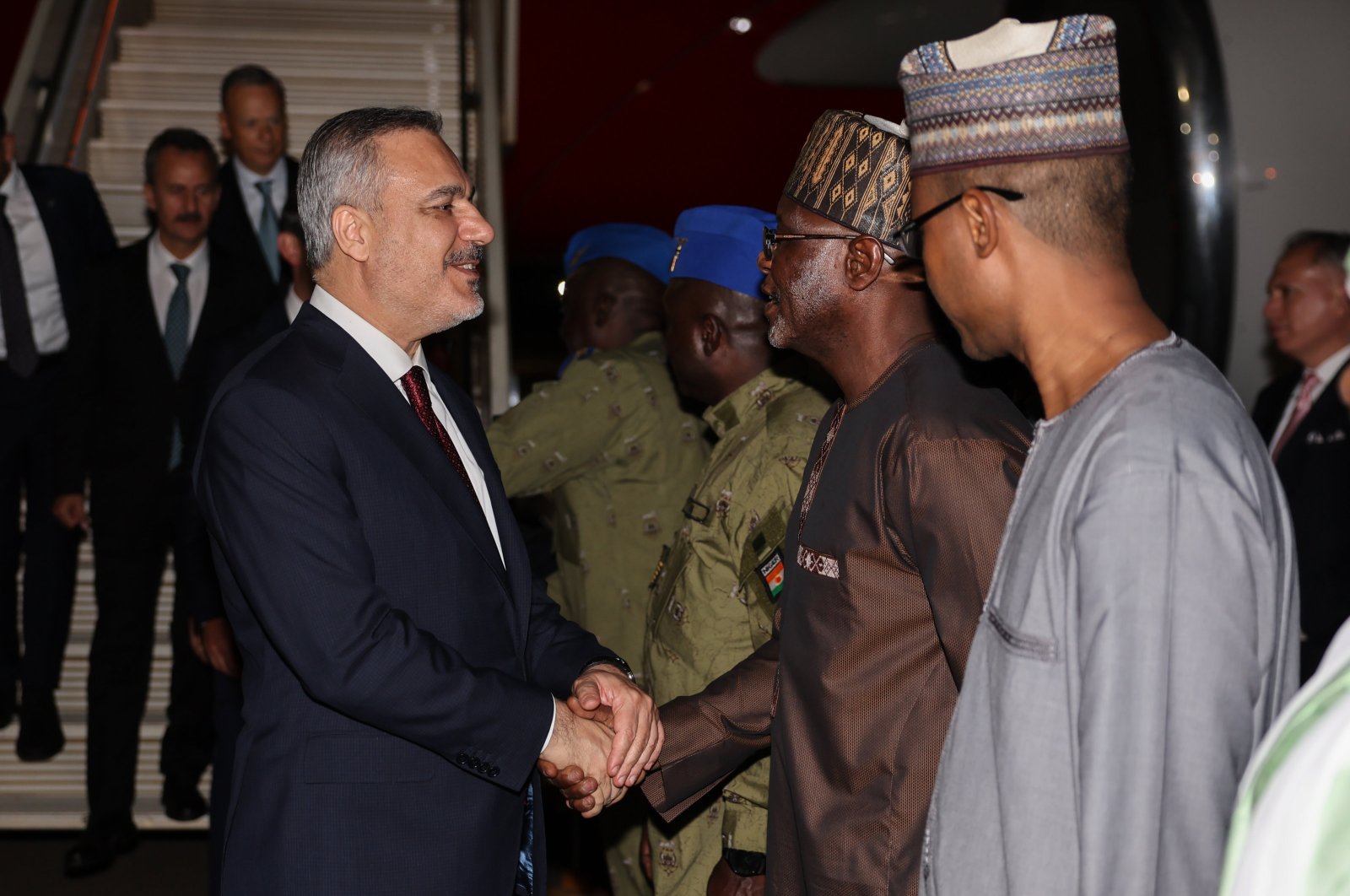 Local officials welcome Foreign Minister Hakan Fidan (L) at the airport, Niamey, Niger, July 17, 2024. (AA Photo)