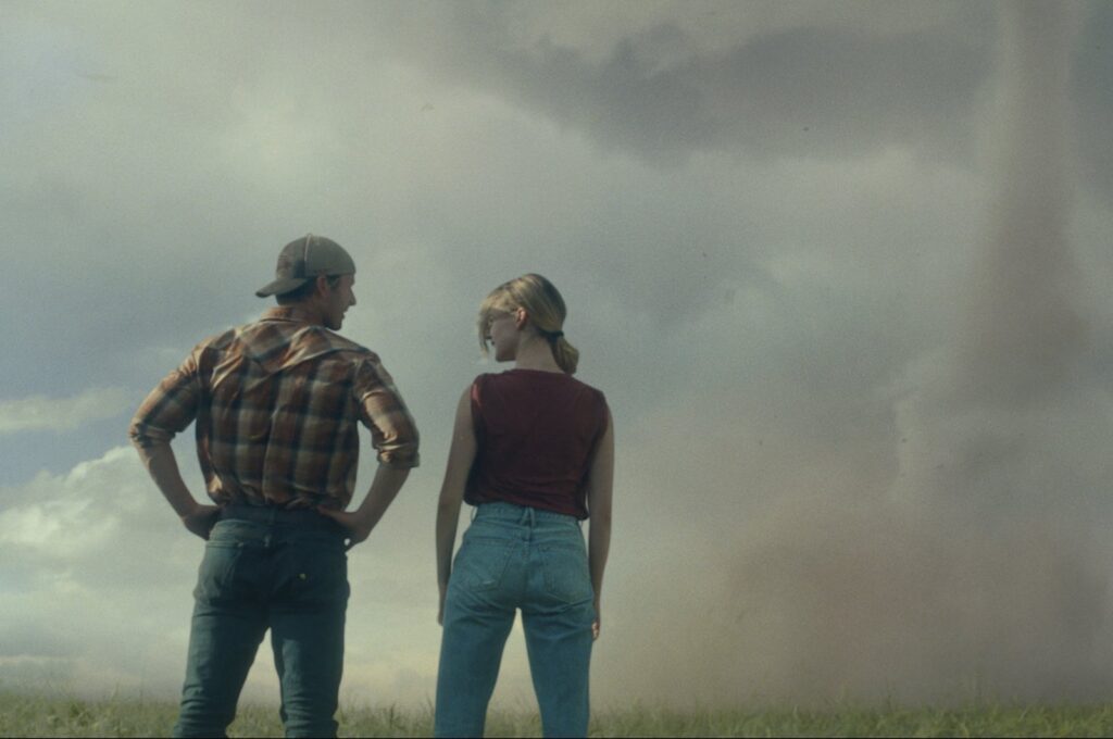 This image released by Universal Pictures shows Glen Powell, left and Daisy Edgar-Jones in a scene from "Twisters." (AP Photo)