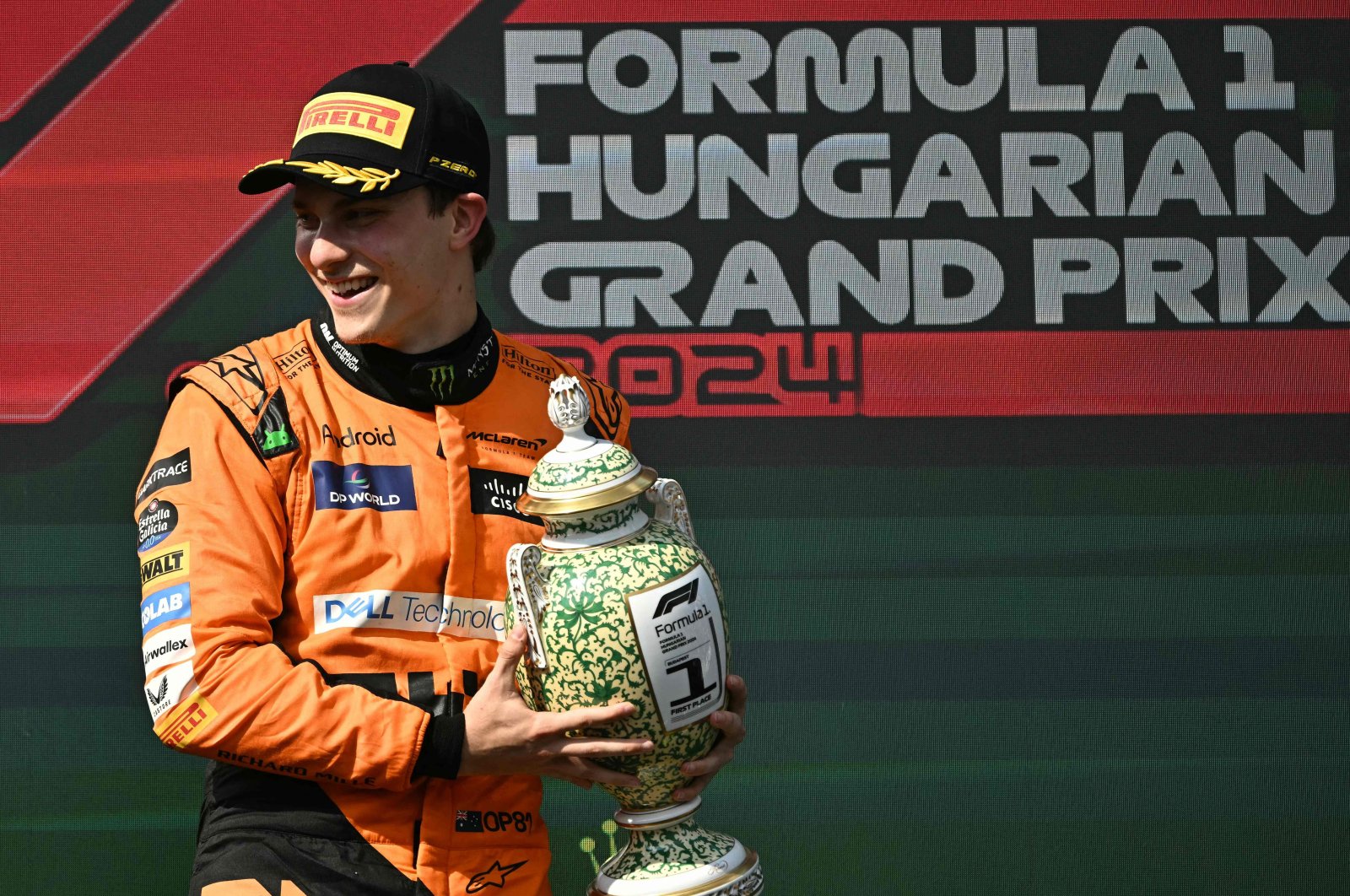 Winner Team McLaren-Mercedes' Oscar Piastri celebrates on the podium with the trophy after the Formula One Hungarian Grand Prix at the Hungaroring race track in Mogyorod, Budapest, Hungary, July 21, 2024. (AFP Photo)