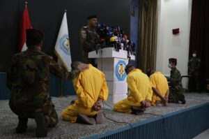 An official from the Iraqi Interior Ministry speaks as three suspected members of the PKK involved in attacks are displayed to the press, Baghdad, Iraq, July 1, 2024. (AA Photo)