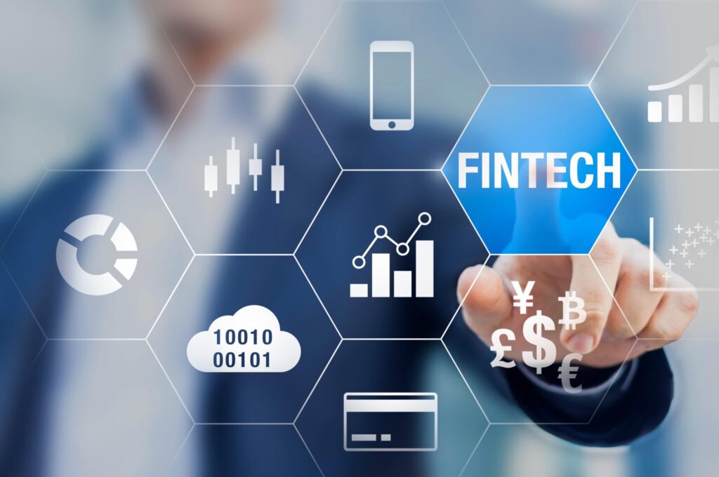 A businessman uses fintech with connected icons of business intelligence charts, cloud computing, currencies payment with blockchain and automation in this illustration photo. (Reuters Photo)