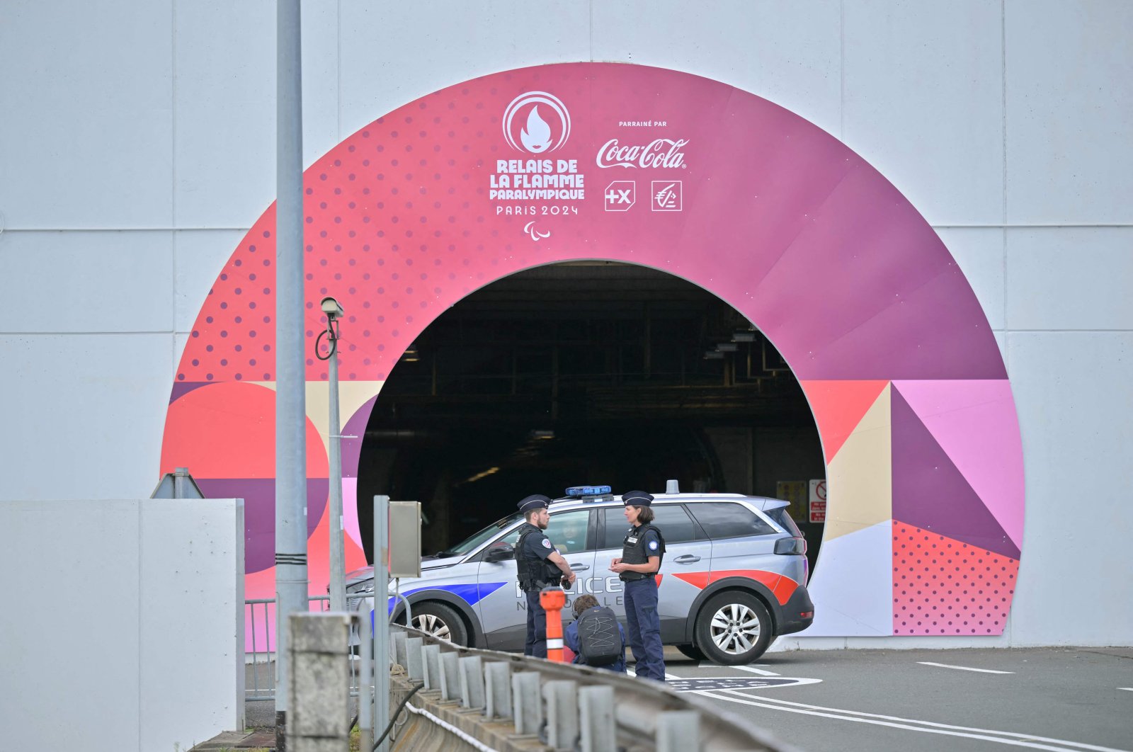 French police stand in position before the arrival of the flame of the Paris 2024 Paralympic Games at the Channel Tunnel in France, after it was lit in Stoke Mandeville of England, Aug. 25, 2024. (AFP Photo)