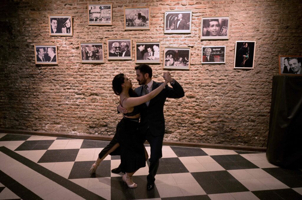 Professional "Tango Taxi dancers" David Tolosa and Laura Florencia Guardia pose for a picture during a milonga at the Marabu tango saloon in Buenos Aires, Argentina, Aug. 17, 2024. (AFP Photo)
