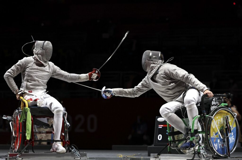 Hao Li (L) of Team China competes against Artem Manko of Team Ukraine during the Men's Sabre Individual Category A Final on Day 1 of the Tokyo 2020 Paralympic Games at Makuhari Messe Event Hall, Tokyo, Japan, Aug. 25, 2021. (Getty Images Photo)