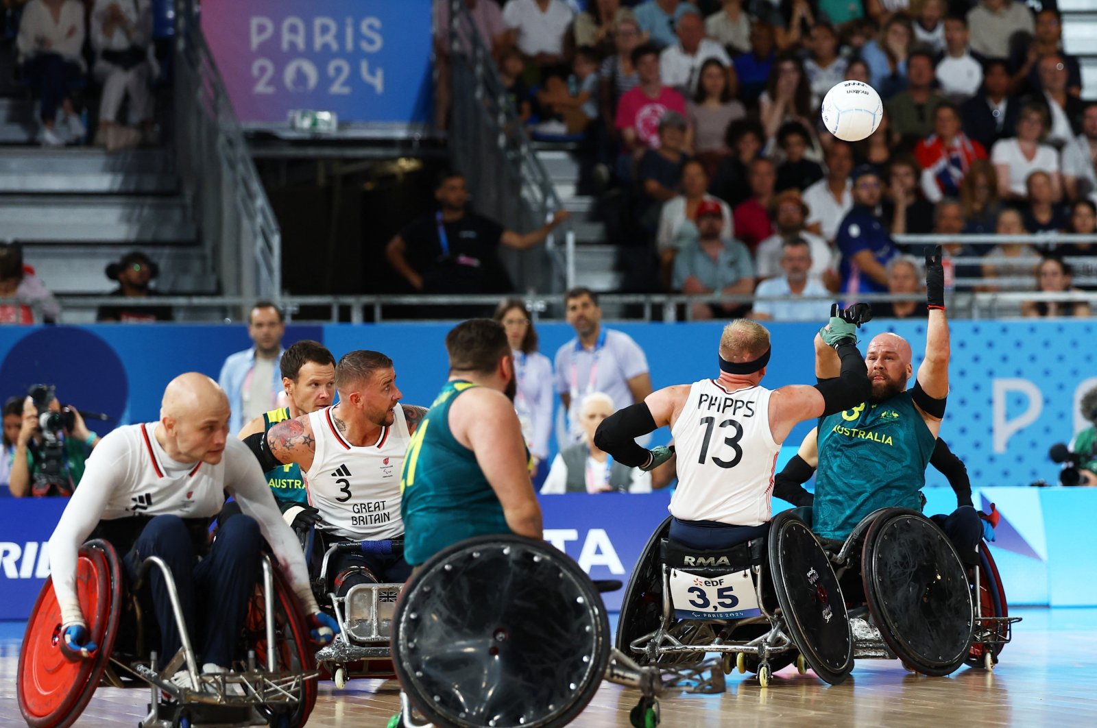 Australia's Ryley Batt (R) in action with Britain's Aaron Phipps during the Paris 2024 Paralympics wheelchair rugby preliminary round Group A match at the Champ de Mars Arena, Paris, France, Aug. 29, 2024. (Reuters Photo)