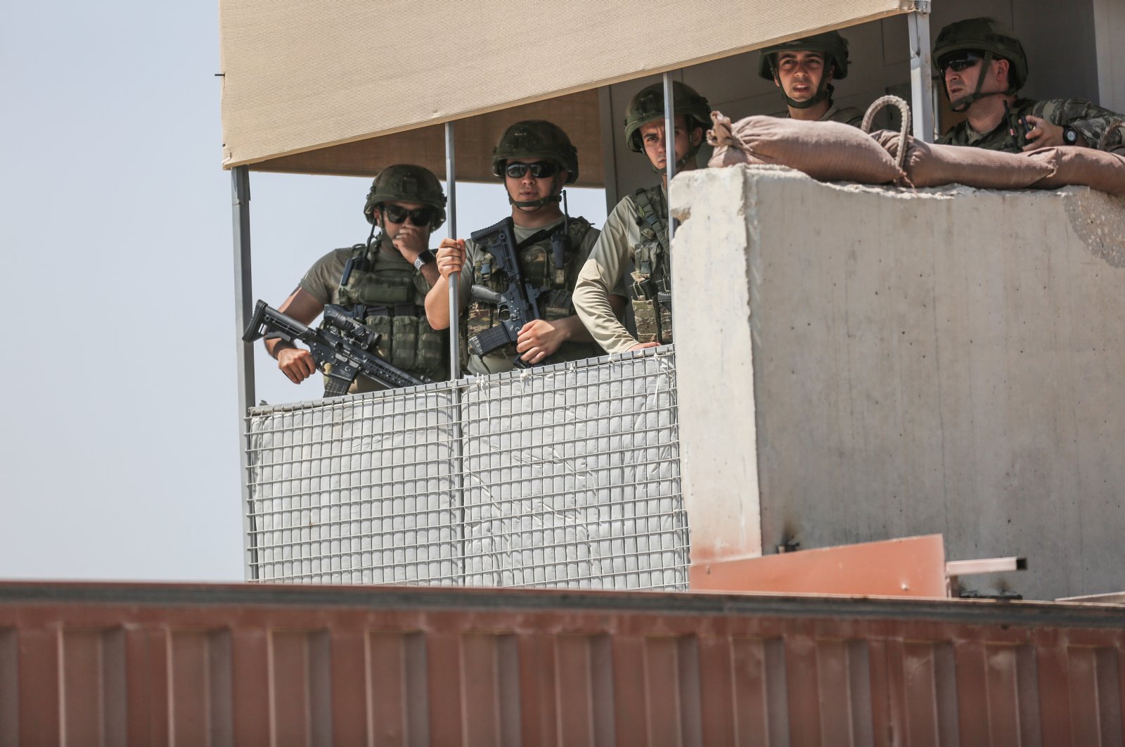 Turkish soldiers look on from a Turkish military outpost in the village of Maataram, Syria, July 23, 2021. (Reuters Photo)