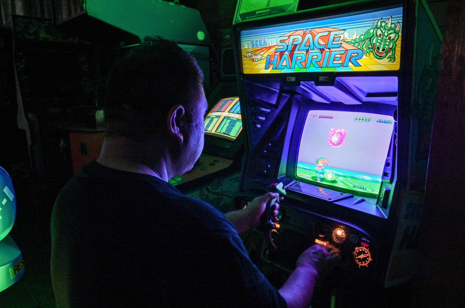 Vintage video game collector "Proudro" plays a vintage video game at his home in Kasumigaura, Ibaraki prefecture, Japan, June 24, 2024. (AFP Photo)