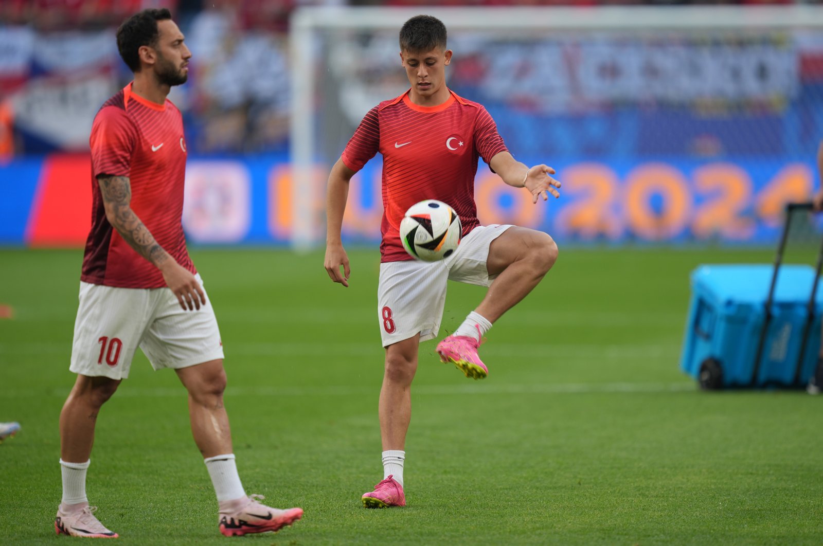 Hakan Çalhanoğlu (L) and Arda Güler of Türkiye warm up before the match with Czhechia during the UEFA European Football Championship in Hamburg, Germany, June 26, 2024. (Getty Images Photo)