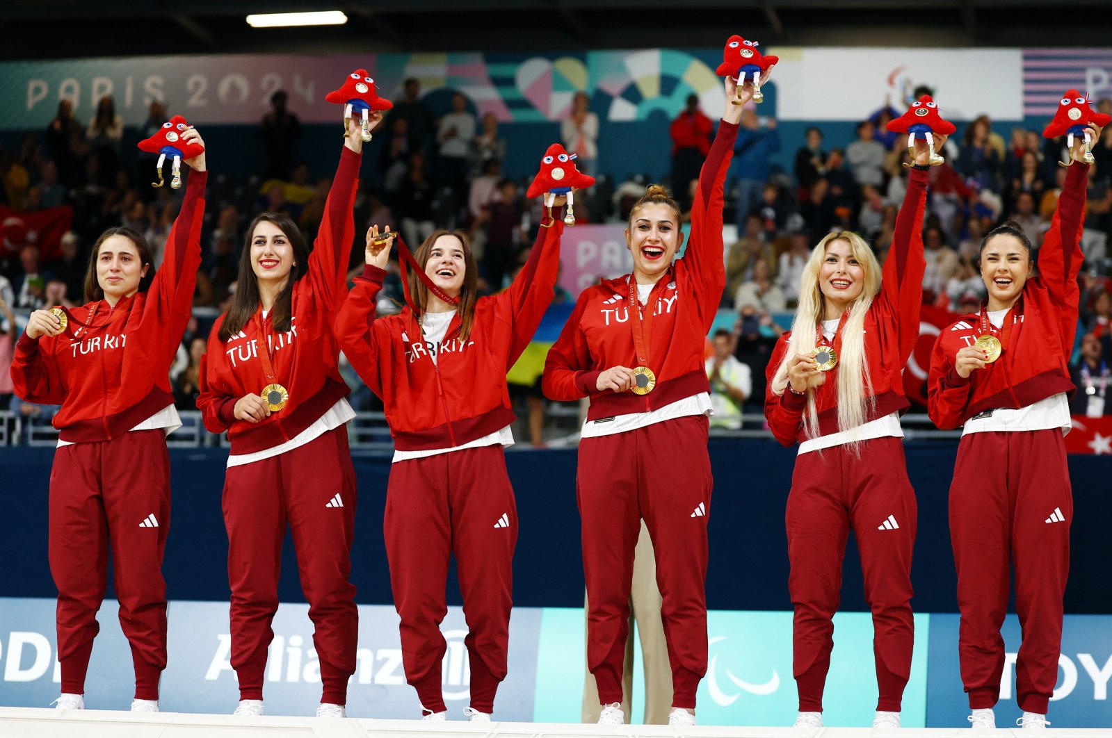 Gold medalists Fatma Gül Güler, Reyhan Yılmaz, Sevda Altunoluk, Seydanur Kaplan, Sevtap Altunoluk and Berfin Altan of Türkiye celebrate on the podium after defeating Israel in the final match in the women's goalball at the Paralympics in Paris, France, Sept. 5, 2024. (Reuters Photo)