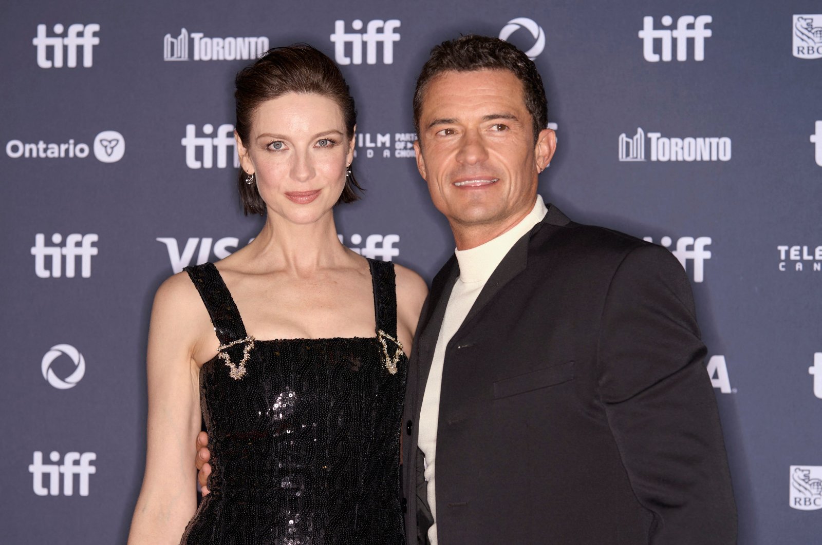 Irish actress Caitriona Balfe (L) and British actor Orlando Bloom arrive for the premiere of "The Cut" during the Toronto International Film Festival, Toronto, Canada, Sept. 5, 2024. (AFP Photo)