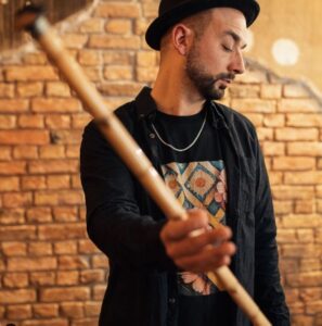 Tayfun Guttstadt holds a ney, a traditional Turkish musical instrument, and poses for the photo. (Tayfun Guttstadt Instagram Photo)