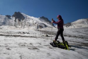 Glaciologist Gulbara Omorova takes measurements of a glacier using an ablation stake in the Tian Shan mountain range, Tian Shan, Kyrgyzstan, July 8, 2024. (AFP Photo)