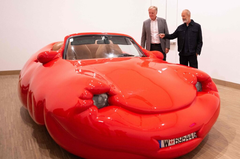 General director of Albertina Klaus Albrecht Schroeder (L) and Austrian artist Erwin Wurm react next to his work "Fat Convertible," Vienna, Austria, Sept. 12, 2024. (AFP Photo)