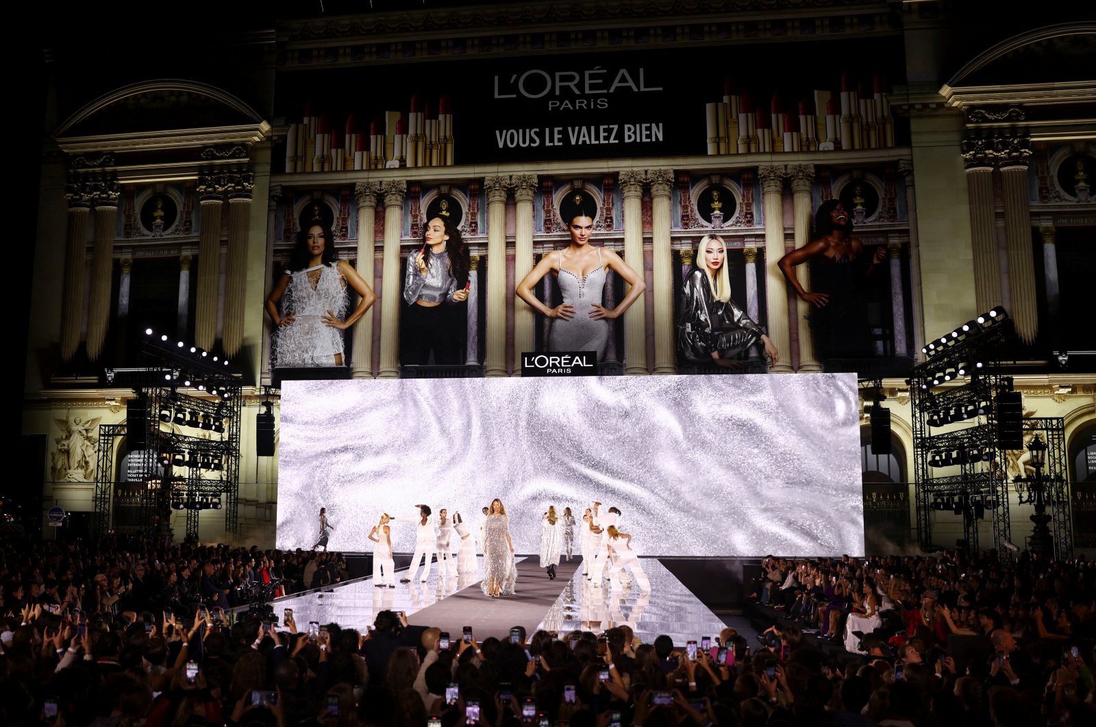 A model presents a creation during a public show named "Walk Your Worth" organized by L'Oreal near the Opera Garnier as part of Paris Fashion Week, Paris, France, Sept. 23, 2024. (Reuters Photo)