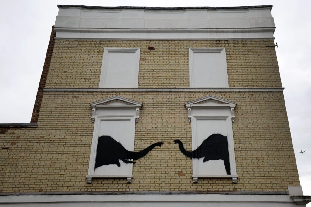 A new artwork by British anonymous street artist Banksy depicts two elephants on the side of a house in Chelsea, London, U.K., Aug. 6, 2024. (EPA Photo)