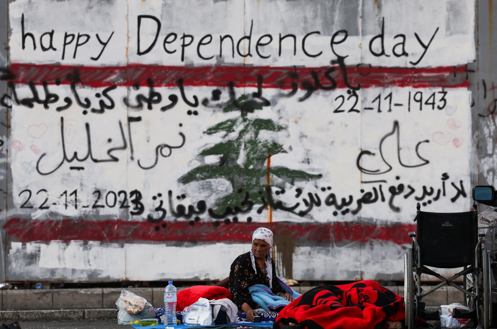 A displaced woman looks on next to her makeshift encampment on the street at Beirut's central Martyrs' Square, where many families spent the night while fleeing the overnight Israeli strikes in southern Beirut, Lebanon, Oct. 9, 2024. (Reuters Photo)