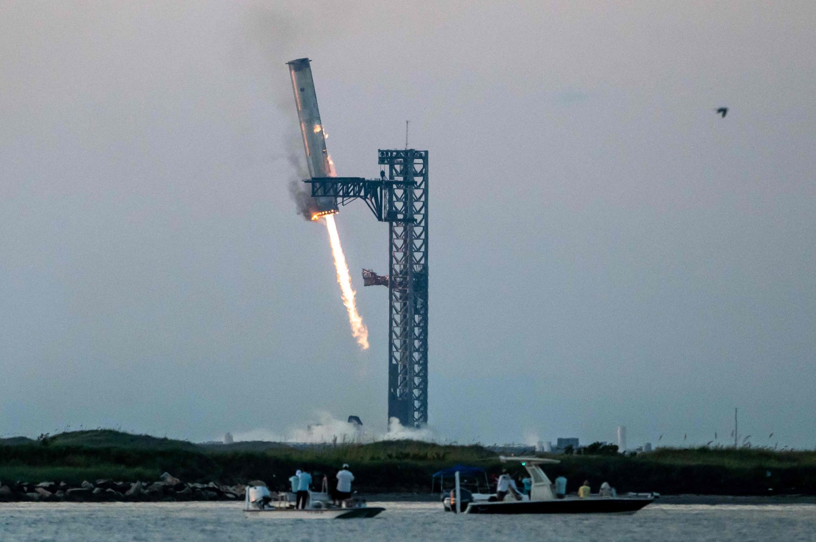 Starship's Super Heavy Booster is grappled at the launch pad in Starbase near Boca Chica, Texas during the Starship Flight 5 test, U.S., Oct. 13, 2024. (AFP Photo)