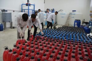 The Bitlis Eren University team works on liquid soap produced from Lake Van's alkaline waters, Bitlis, Türkiye, Oct. 21, 2024. (IHA Photo)