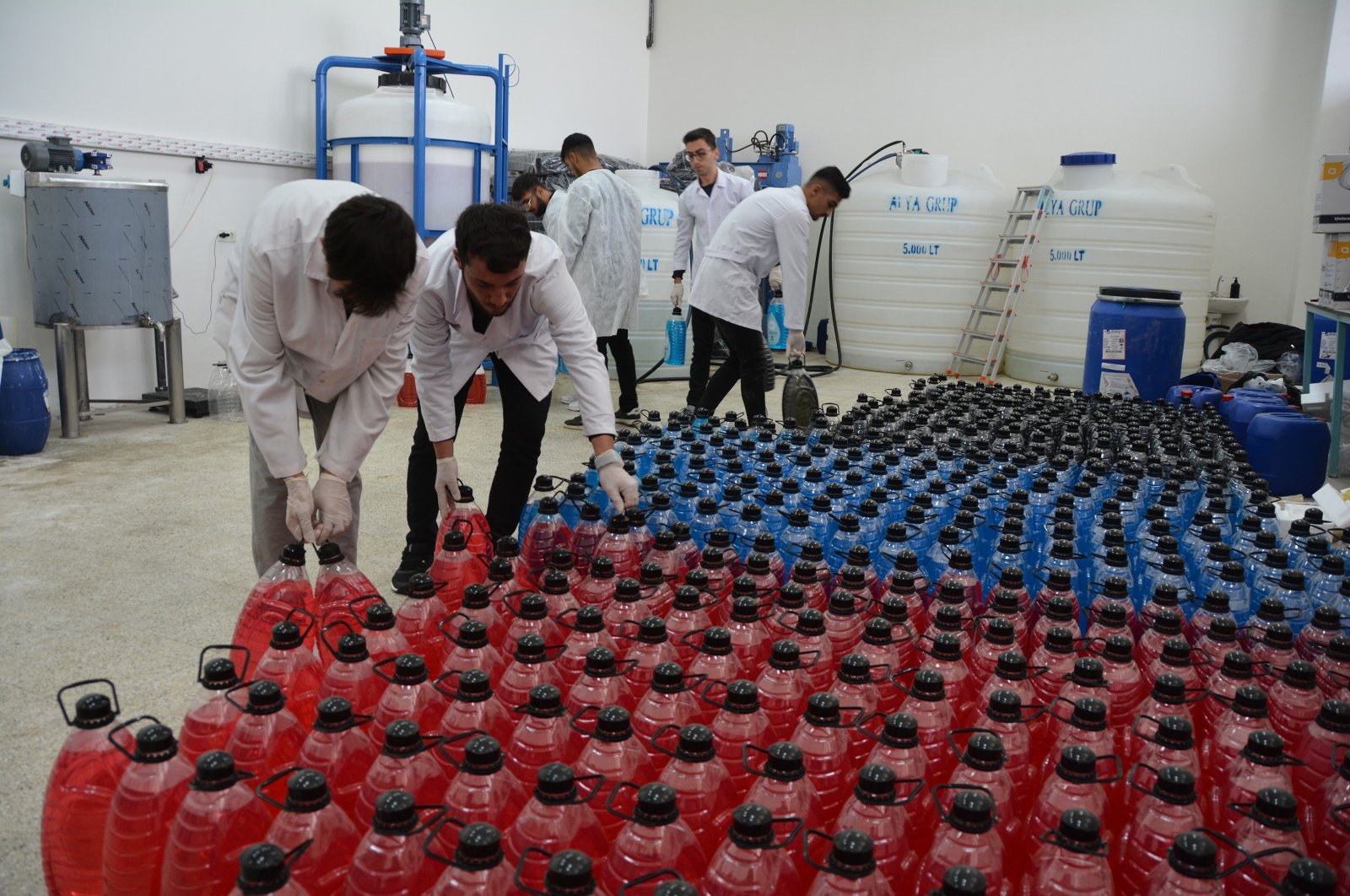 The Bitlis Eren University team works on liquid soap produced from Lake Van's alkaline waters, Bitlis, Türkiye, Oct. 21, 2024. (IHA Photo)