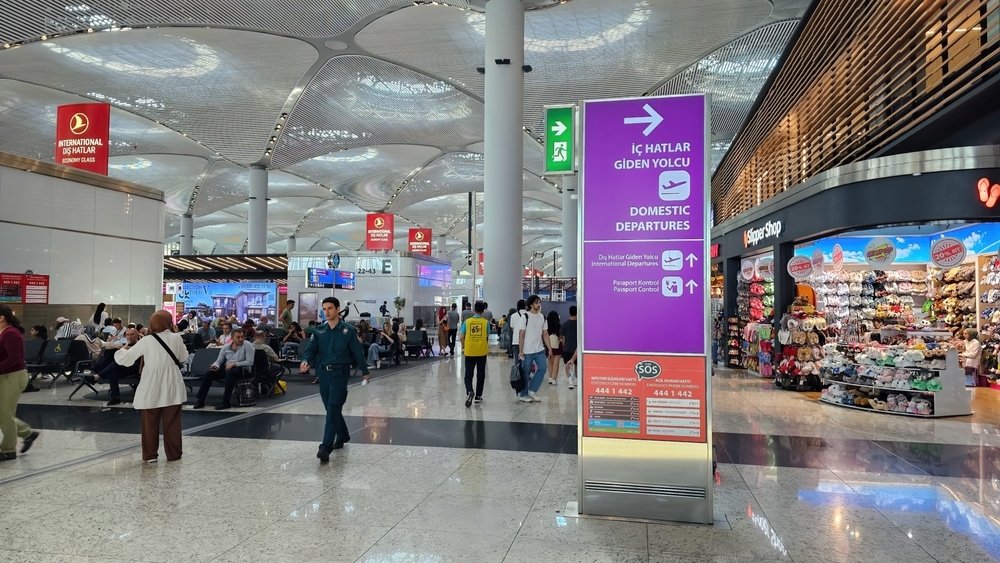 A sign directs passengers to domestic departure flights in Istanbul Airport, Istanbul, Türkiye, June 27, 2023. (Shutterstock Photo)