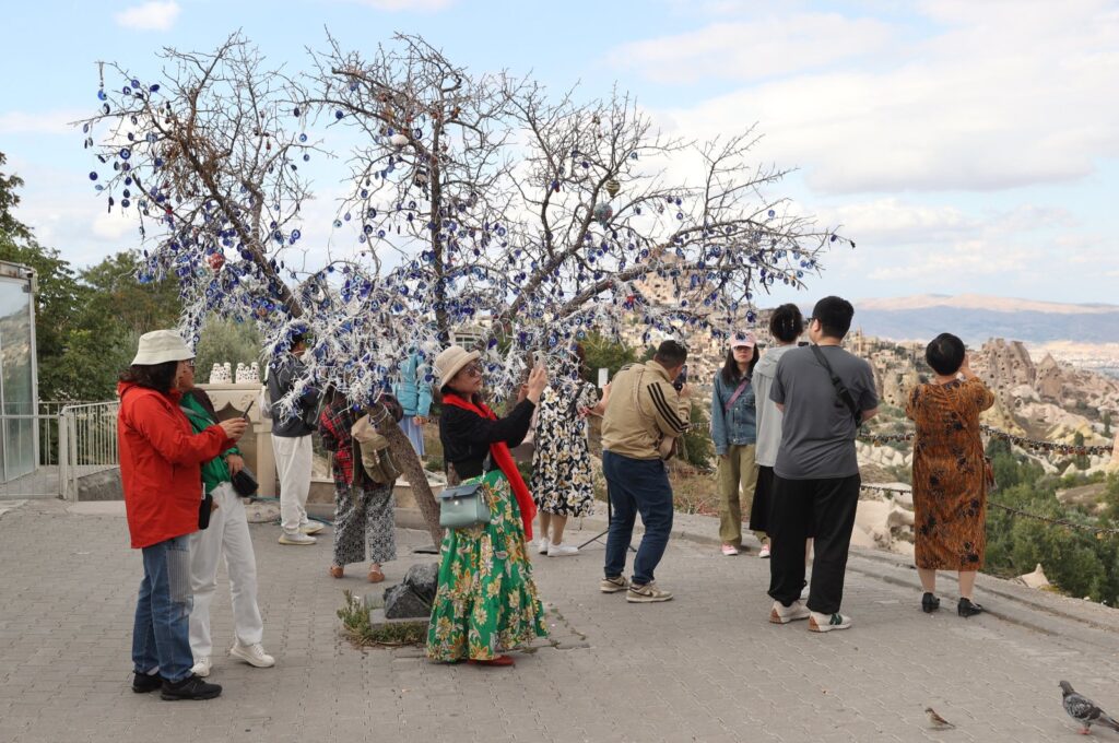 Chinese tourists take photos in the famous Cappadocia region, Nevşehir, central Türkiye, Oct. 1, 2024. (AA Photo)