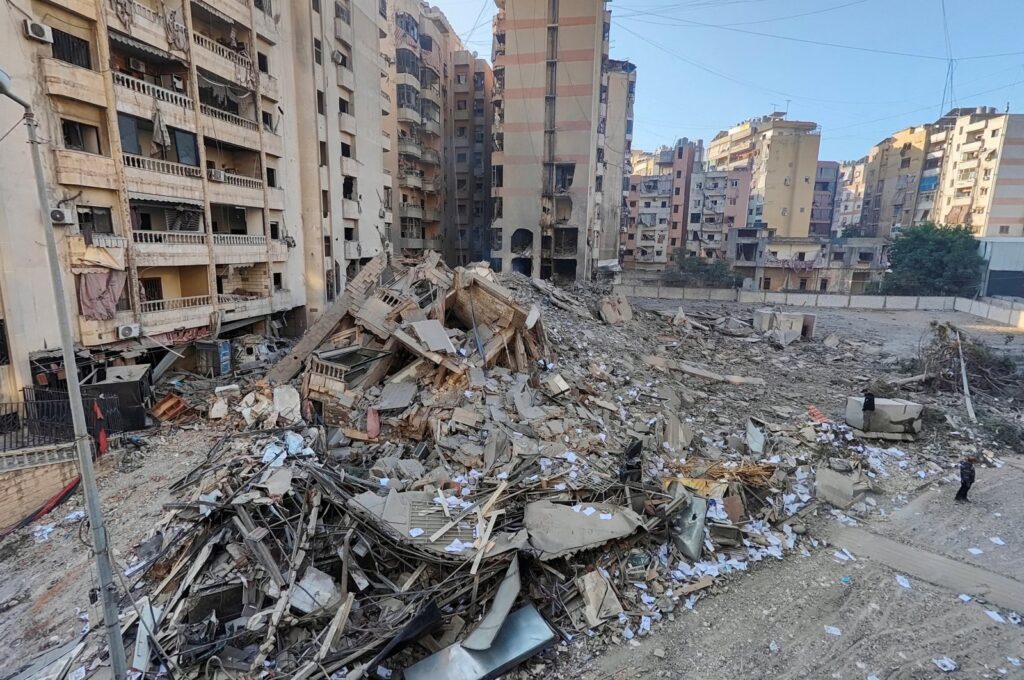 People stand at a site damaged in the aftermath of Israeli strikes, Beirut, Lebanon, Nov. 1, 2024. (Reuters Photo)