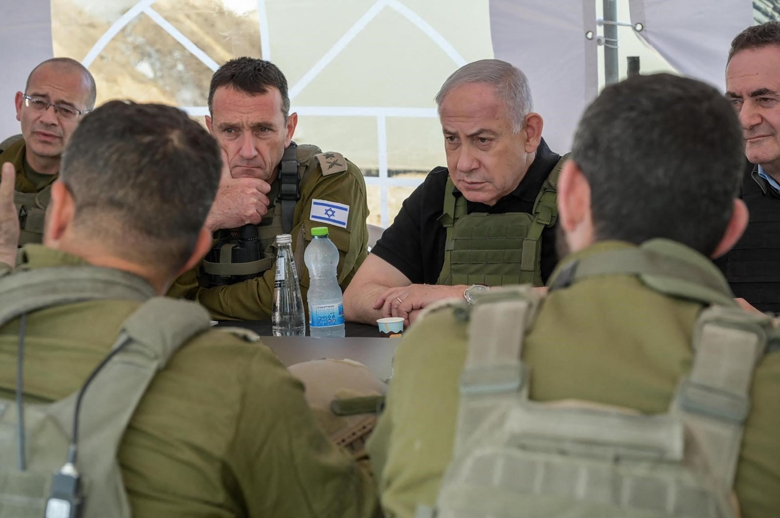 This handout picture released by the Government Press Office (GPO) shows Israel's Prime Minister Benjamin Netanyahu (R), Defense Minister Israel Katz (R) and army Chief-of-Staff Herzi Halevi (2nd L) during a briefing in the Netzarim Corridor just south of Gaza City, Nov. 19, 2024. (AFP Photo)