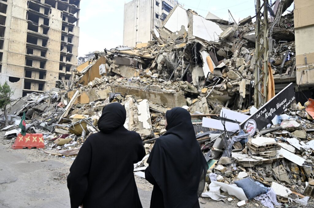 Lebanese women look at a damaged building after a cease-fire with Israel came into effect, in the Dahieh district in southern Beirut, Lebanon, Nov. 27, 2024. (AFP Photo)
