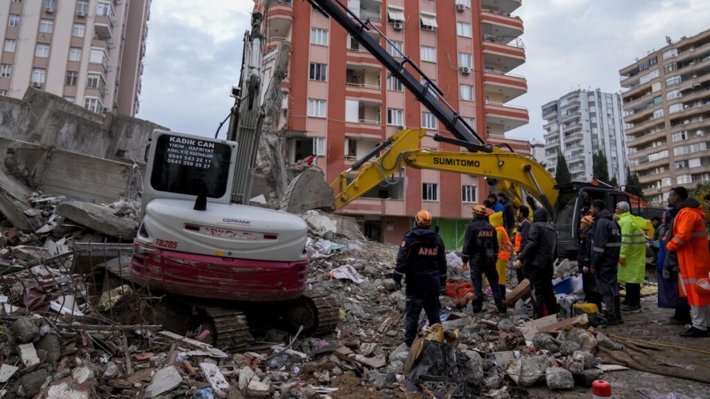 Emergency teams search for people in the rubble of a destroyed building, Adana, southern Türkiye, Feb. 6, 2023. (AP Photo)
