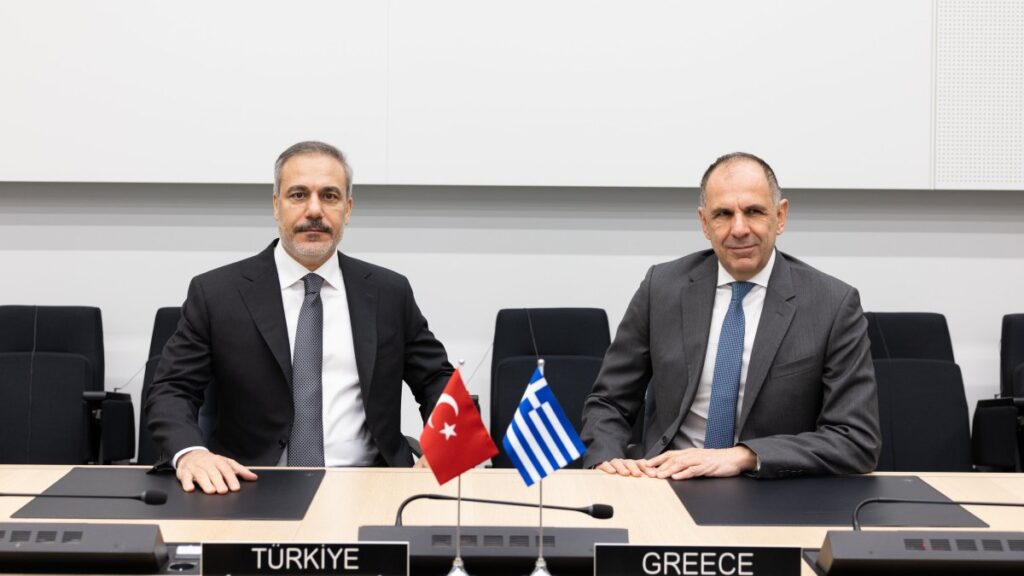 Foreign Minister Hakan Fidan and his Greek counterpart Giorgos Gerapetritis meet on the sidelines of a NATO meeting, Brussels, Belgium, Dec. 4, 2024. (AA Photo)