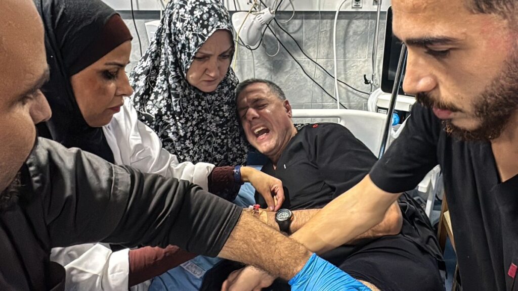 Hossam Abu Safieh, director of the Kamal Adwan Hospital, is treated by colleagues for his injuries from an Israeli strike that hit the hospital, Beit Lahia, Gaza Strip, Palestine, Nov. 23, 2024. (AFP Photo)