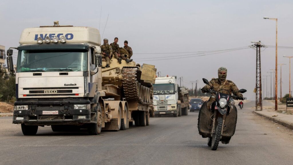 Syrian anti-regime forces transport military vehicles as they drive through the Hama governorate, Syria, Dec. 7, 2024. (AFP Photo)