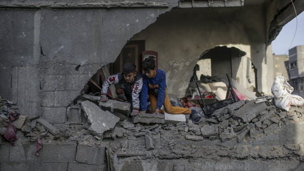 Two Palestinian brothers inspect the rubble of a damaged building following Israeli airstrikes in Al Nuseirat refugee camp, central Gaza Strip, Palestine, De. 7, 2024. (EPA Photo)