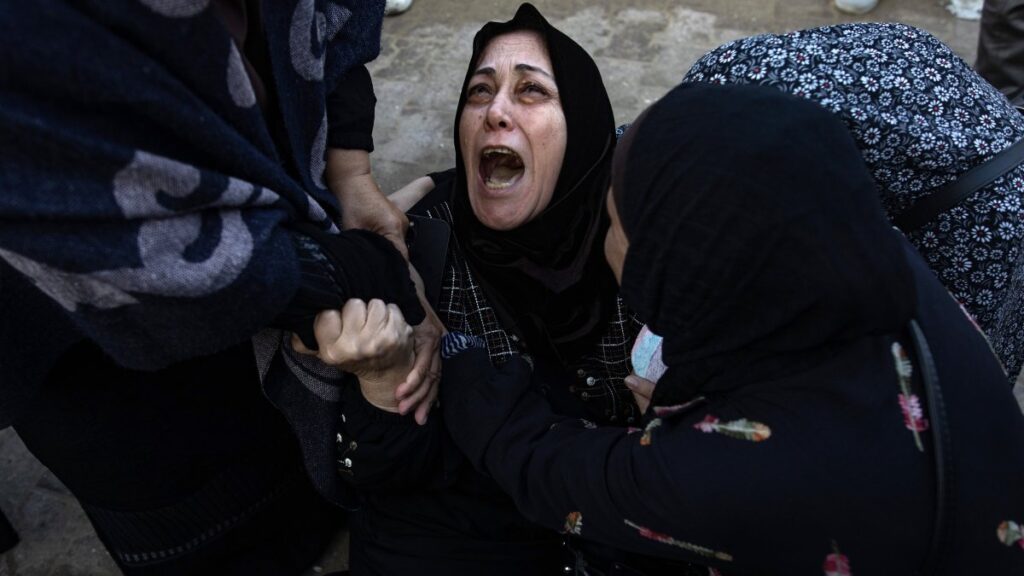 Palestinians mourn next to the bodies of their relatives who were killed in an Israeli airstrike, Khan Younis, southern Gaza Strip, Dec. 12, 2024. (EPA Photo)