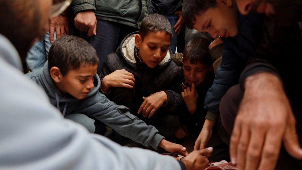 Palestinians mourn relatives killed in an Israeli strike, amid the ongoing conflict between Israel and Hamas, in Nuseirat, Gaza Strip, Palestine, Dec. 11, 2024. (Reuters Photo)
