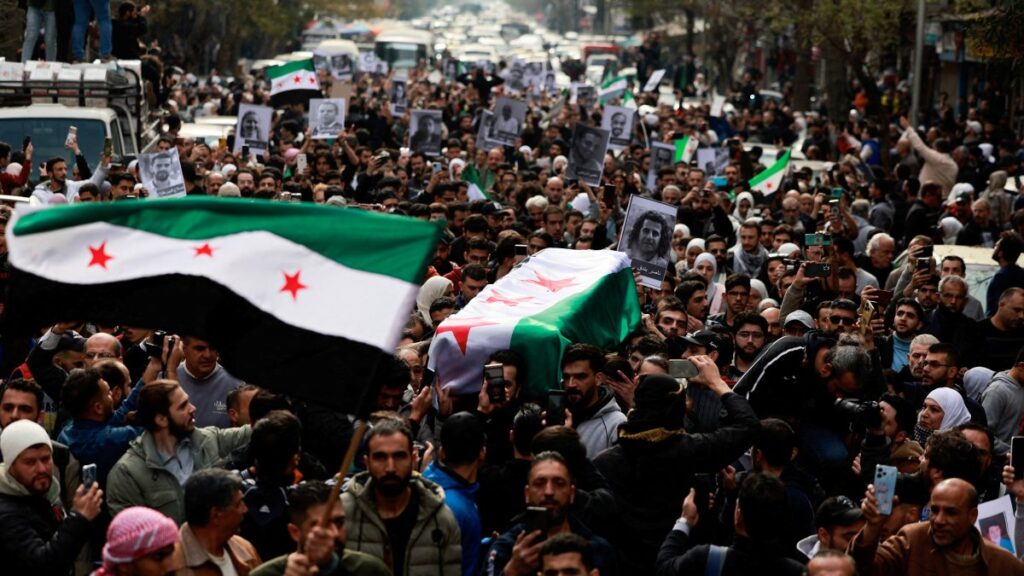 People carry the body of Syrian activist Mazen al-Hamada, who according to Syrian activists was found dead in a prison, Damascus, Syria, Dec. 12, 2024. (Reuters Photo)
