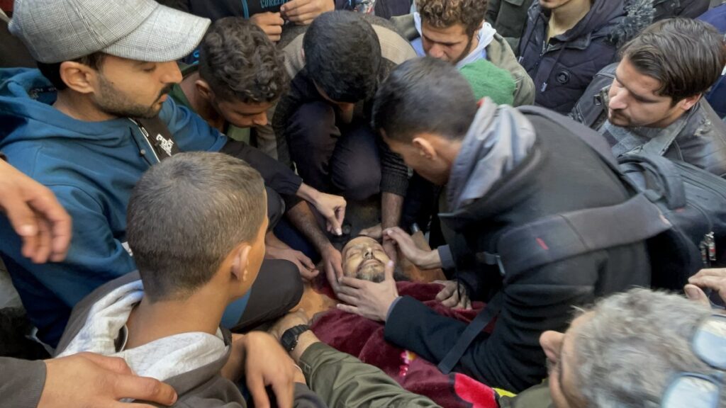 Khaled Nabhan's lifeless body is taken from the morgue of Awde Hospital for funeral prayers and burial after an Israeli attack at the Nuseirat refugee camp in Gaza City, Dec. 16, 2024. (AA Photo)