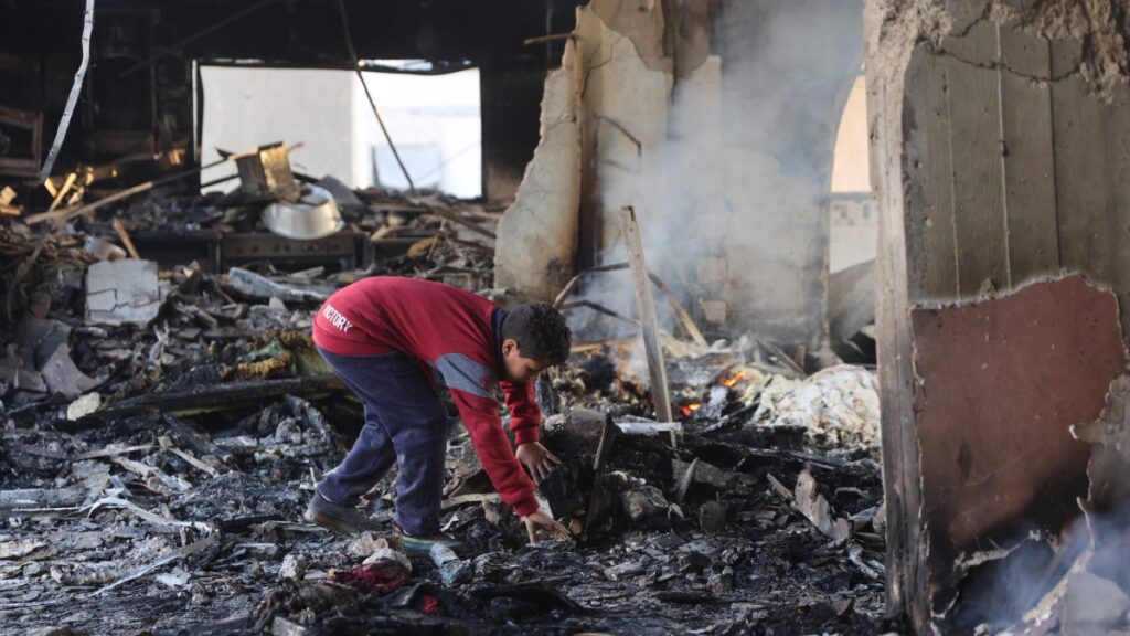 A Palestinian boy inspects the damage at the site of an Israeli airstrike on a building in Daraj neighborhood, Gaza City, Gaza, Palestine, Dec. 17, 2024. (AFP Photo)